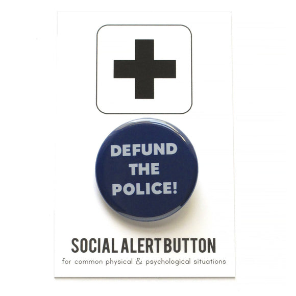 Round pinback button that says DEFUND THE POLICE. Light gray text on a navy blue background.