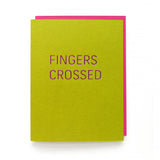 Rich lime green greeting card with magenta hot foil emboss that reads FINGERS CROSSED in a thin sans serif font. With Deep pink matching envelope.