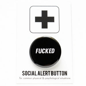 Product photo of a 1.25" pinback button on a cardboard social alert backing card.  The background of the button is black and the white text says FUCKED