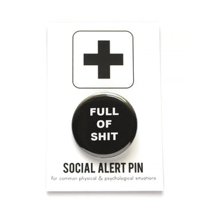 Round pinback button that says FULL OF SHIT. White text on a black background.
