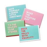 Four rich pastel holiday christmas cards with sans serif font, reading left to right: HAVE YOURSELF A QUEER LITTLE CHRISTMAS is a rich pastel teal with white text and a pink drop shadow. MAKE THE YULETIDE GAY is a rich pin card with white text and a pastel mint green drop shadow. DECK THE HALLS WITH EQUALITY is a medium green-blue color with red text and a white drop shadow.  ’TIS THE SEAON TO BE STONED is a medium light green with white text and a red drop shadow.