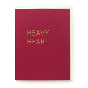 Burgandy greeting card that says HEAVY HEART in gold hot foil pressed text.