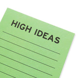 Close up of lined mint green notepad that reads HIGH IDEAS at the top in bold black text. 