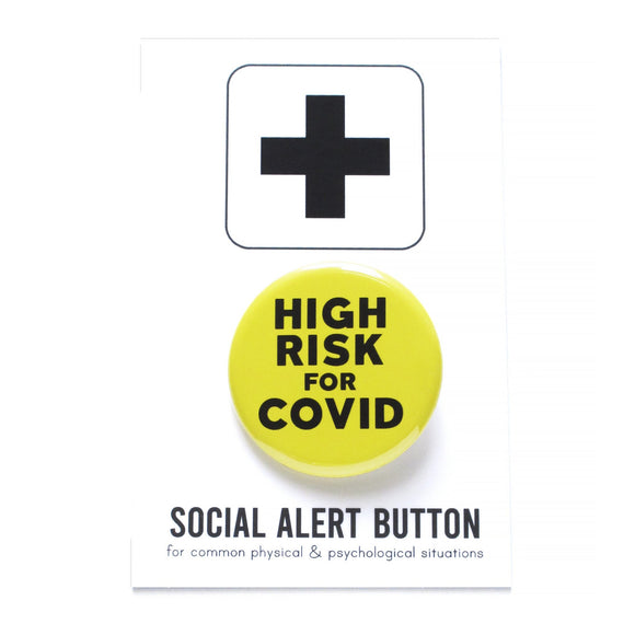 Round pinback button that says HIGH RISK FOR COVID.  Black text on an yellow background.