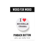 Round white pinback button that reads I Love Michelle Obama, love being indicated with a red heart graphic. Button is on a Word for Word branded backing card.