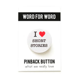 Round white pinback button that reads I heart short stories with the heart being a bright red heart. On a Word For Word branded backing card. What We Really Love.