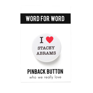Round pinback button on a white background that says I love Stacey Abrams. Love is depicted by a red heart. The other text is black.