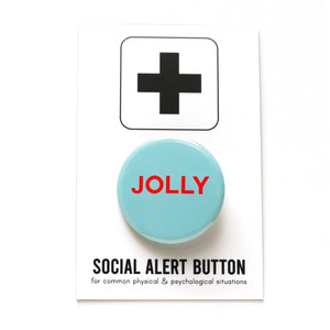 Pale blue-green round pinback button that reads JOLLY in bright red san serif text.  Button is on a Social Alert Button backing card.