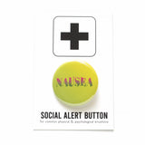 Pinback button with yellow to green ombre background, with pink to green ombre text that reads NAUSEA in a wavy serif font. Shiny pinback button is on a white & black Social Alert Button Backing card which has a black plus sign at the top, and reads for common physical & psychological situations at the bottom.