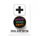 Round, black pinback button that reads NEURO-DIVER-GENT! In three lines with varied bright colors in an askew sans serif font. Button is on a Social Alert Button backing card.