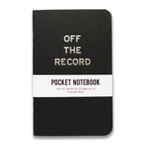 Black vertical pocket notebook with rounded corners. OFF THE RECORD imprinted in silver foil on the front. Wrap around info band reads Pocket Notebook, Hot Foil Pressed In Los Angeles, CA, 40 blank pages 