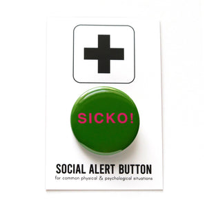 Round rich green pinback button reads SICKO! in hot pink text. On a white backing card, black plus sign at the top. Below reads: Social Alert Button, with tiny text beneath it which says, for common physical & psychological situations