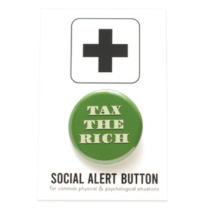 Round pinback button that says TAX THE RICH.  The text is a light green, on a money green background.  The button is on a Social Alert Button backing card.