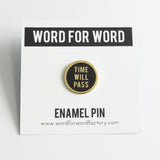 Round enamel pin that says TIME WILL PASS on a Word For Word backing card.