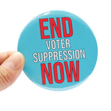Round 3" pinback button that says END VOTER SUPPRESSION NOW.  The word End is in red text, Voter Suppression is in smaller white text, and Now is in red text.  The text is on a light blue background.