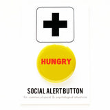 Round pinback button that says HUNGRY.  Red text on a yellow background.  The button is pinned to a Social Alert Button card.