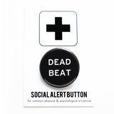 Round pinback button that says DEAD BEAT. White text on a black background.